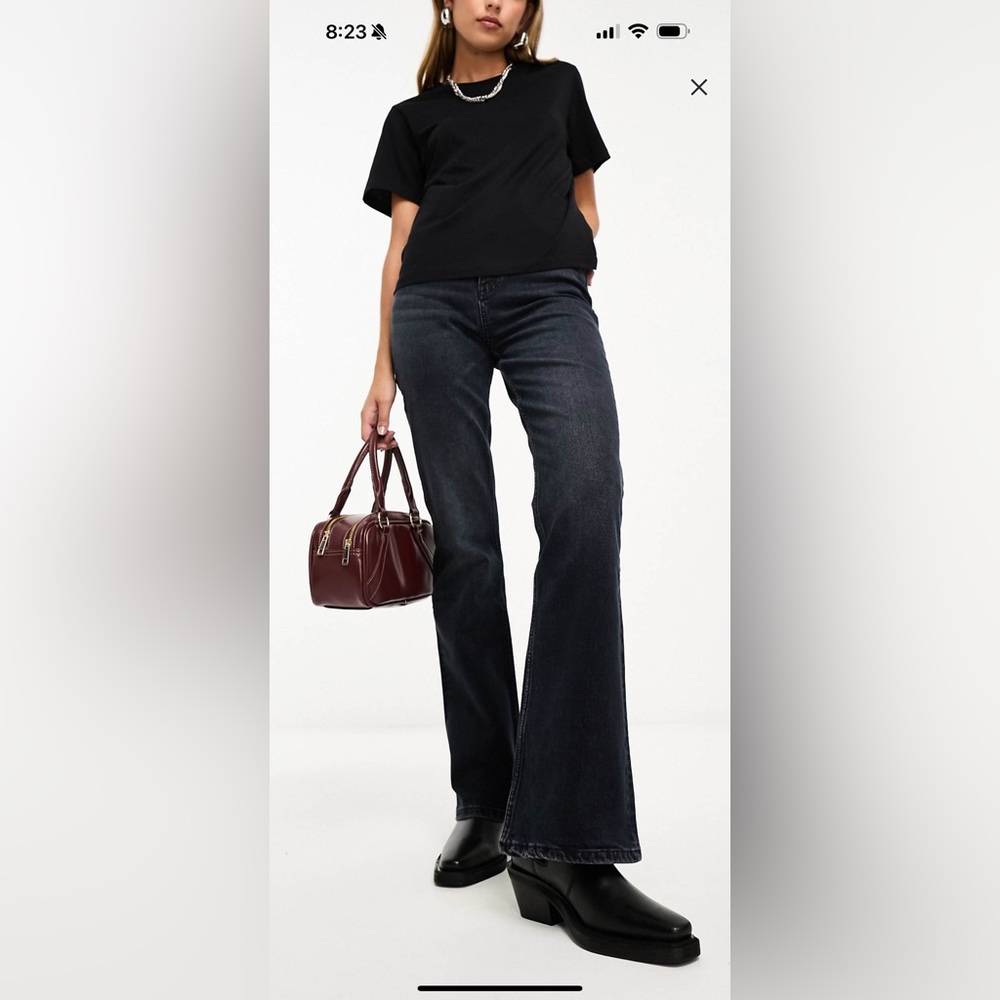 ASOS DESIGN mid rise flare jeans in blue black